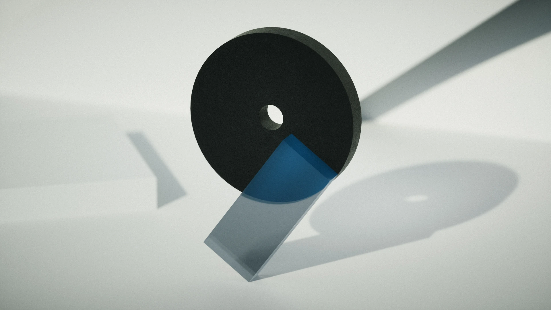 Abstract 3D shape with a dark disc and blue accent segment on a light grey background