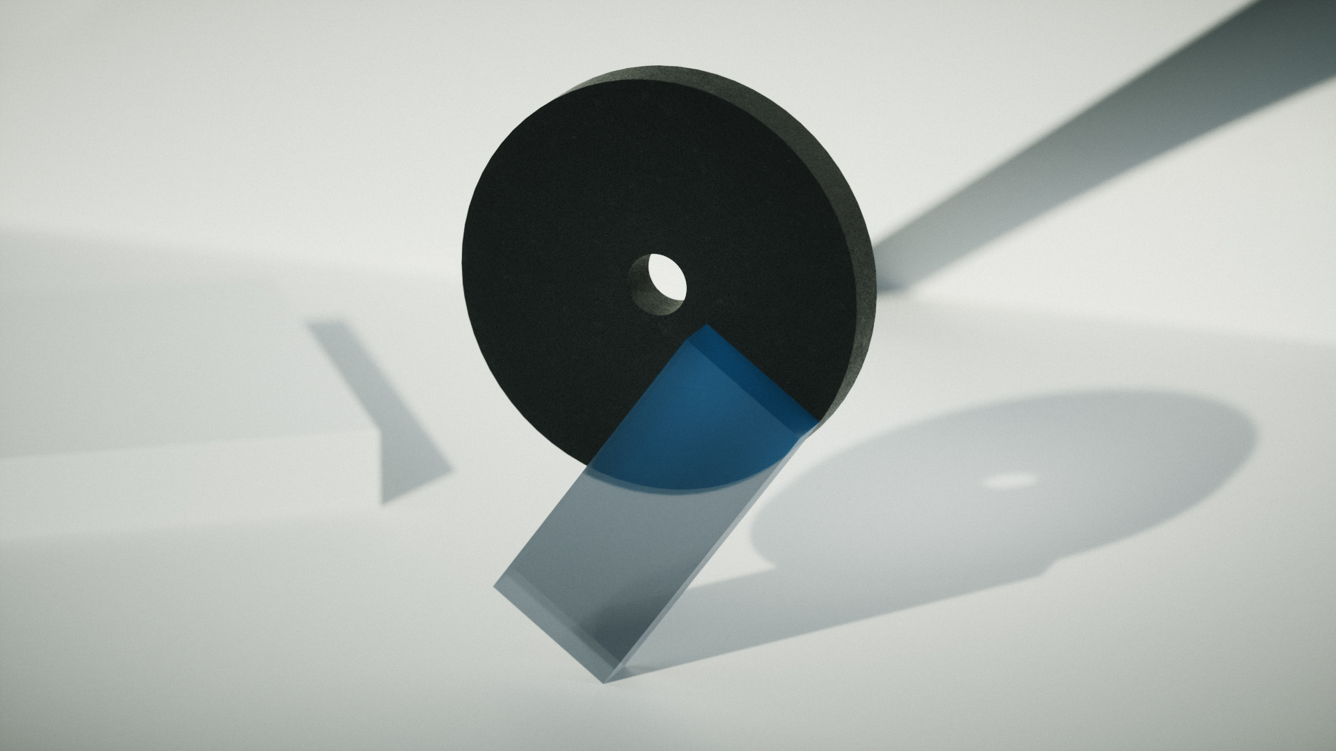 Abstract 3D shape with a dark disc and blue accent segment on a light grey background